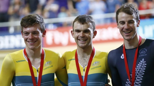 Australia's gold medal winner Jack Bobridge (centre) stands with compatriot and silver medal winner Alex Edmondson (left) and New Zealand's bronze medal winner Marc Ryan during the ceremony for the Men's 4000m Individual Pursuit finals cycling race.