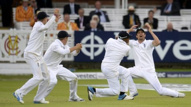 England's captain Alastair Cook (R) reacts as an edge from Sri Lanka's Nuwan Pradeep fell short of the slips.