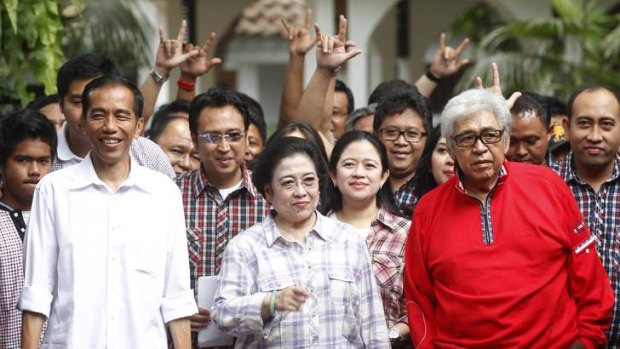 Outsider ... the surprise winner of the governorship of Jakarta, Joko Widodo, left, with the former president Megawati Sukarnoputri and other supporters.
