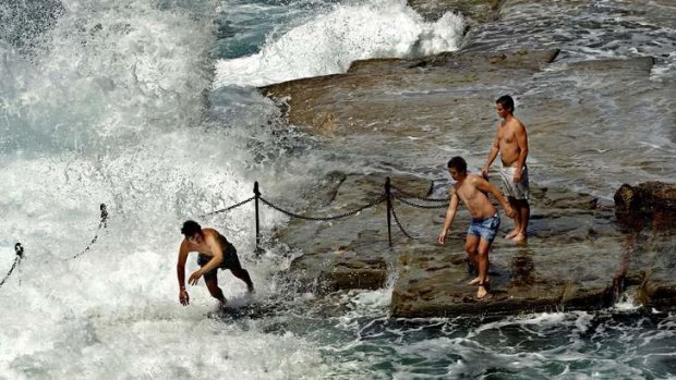 Swimmers take a rough dip at The Bogey Hole in Newcastle.