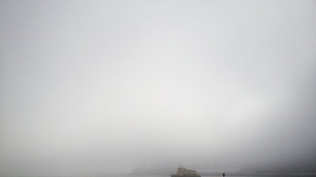 Fog blankets the city skyline in this photo taken from Pyrmont.