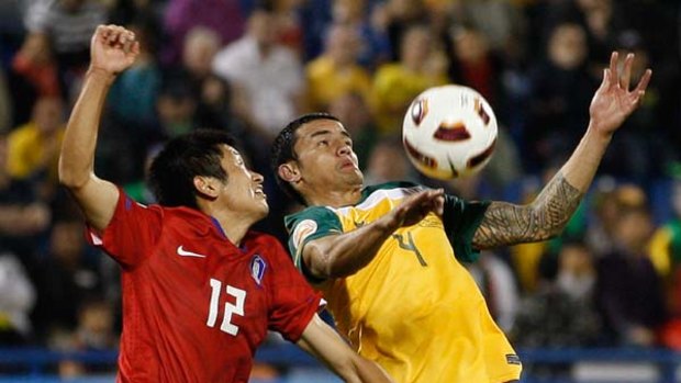 Challenge ... Tim Cahill contests possession against South Korea. The Socceroos star has worked quickly to advocate flood victim relief.