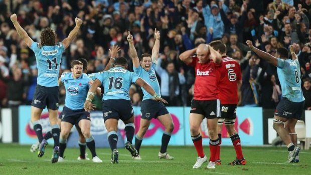 Bounce back: Elated Waratahs players celebrate victory over the Crusaders.