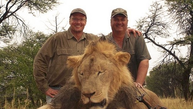 US dentist Walter Palmer, left, and a Zimbabwean guide with the corpse of Cecil the lion.