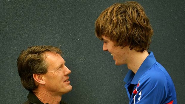 Top dogs: Former Footscray great Brian Cordy with son Ayce.