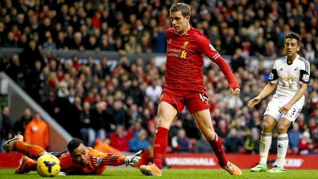 Goal fest: Liverpool's Jordan Henderson scores his second goal past Swansea's Michel Vorm.