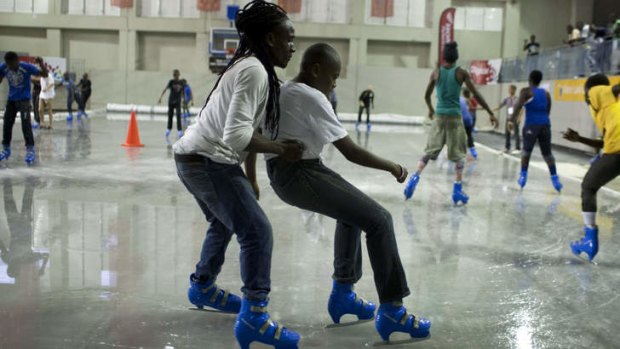 Haitians practice their ice skating skills at a basketball gym that has been transformed to host the upcoming event, "Haiti On Ice" in Port-au-Prince, Haiti.