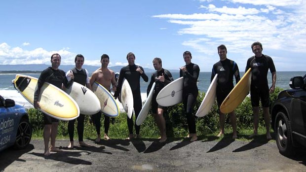 Swell times ... the annual boys-only surfing trip to Culburra Beach gets the thumbs up from this group of mates.