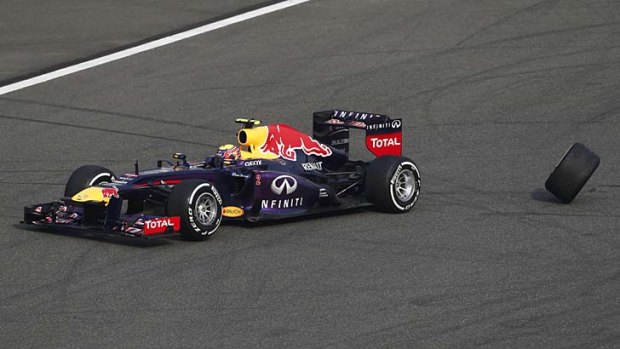 Out of the race: Mark Webber loses his rear wheel.