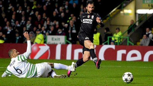 Juventus' Mirko Vucinic scores a goal against Celtic.