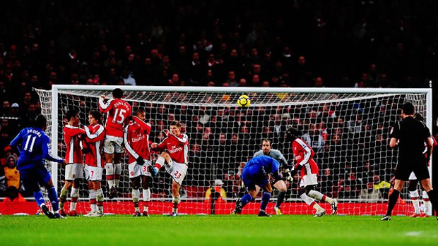 Didier Drogba of Chelsea scores his second goal to give his side a 3-0 lead over Arsenal.