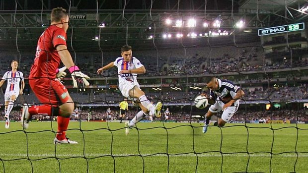 Scene-stealer: Archie Thompson scores the winner for the Melbourne Victory against Perth in Friday's elimination final.