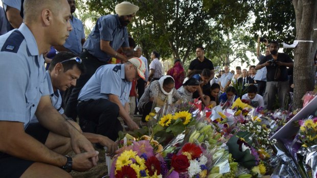 Brisbane bus drivers were among those to pay respect to colleague Manmeet Sharma at a vigil at Moorooka on Saturday evening.