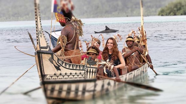 Duchess of Cambridge and Prince William are followed by locals dressed as 'sharks' as they travel in a traditional canoe during a visit to Tuvanipupu Island.