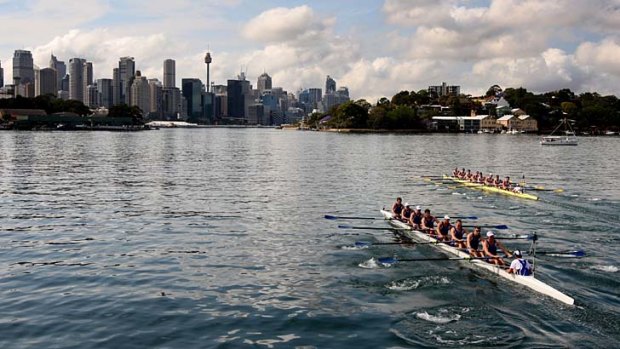 Early rhythm &#8230; the University of Sydney crew lead Melbourne University's boat as they head for Darling Harbour.