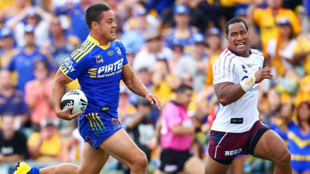 Parramatta's Jarryd Hayne makes a line break as Manly's Tony Williams chases.