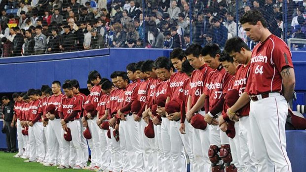 They remember, and won't forget ... Sendai's team, the Tohoku Rakuten Golden Eagles, observe a moment's silence for earthquake and tsunami victims.