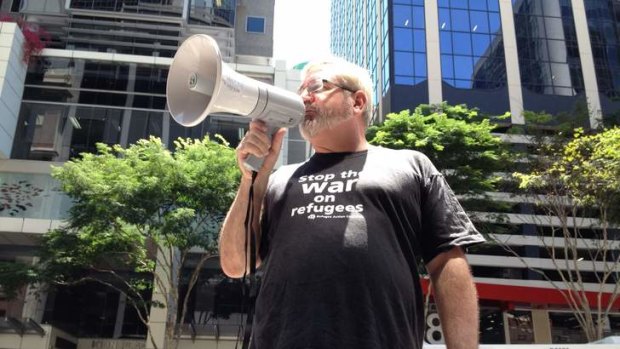 Former senator Andrew Bartlett addresses a Brisbane protest calling for the closure of the Manus Island detention centre.