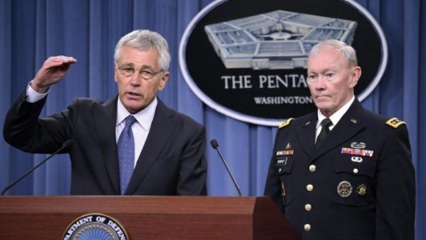 Cost cutting: US Defence Secretary Chuck Hagel with General Martin Dempsey, chairman of the Joint Chiefs of Staff, at his Pentagon briefing on February 24.