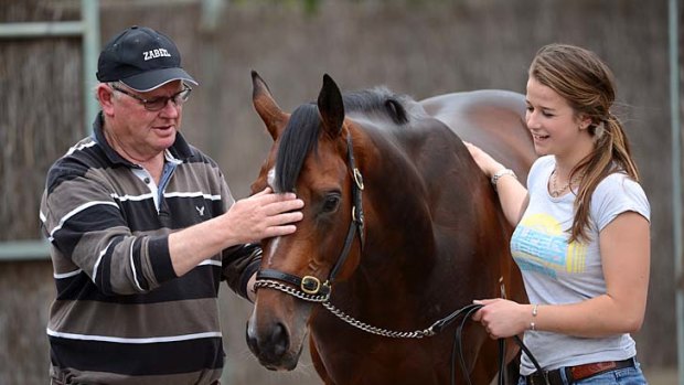 Centre stage and "nobody told him he's small."  It's A Dundeel with trainer  Murray Baker and strapper Emily Murphy.