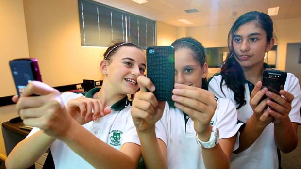 Dial H for homework ...  Bianca Corallo, Elissa Kinda and Laura Ferreira at St Ursula’s College, where mobiles are increasingly being used in the classroom.