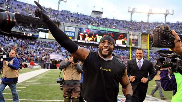 Ray Lewis takes a lap around the field after the Ravens win.