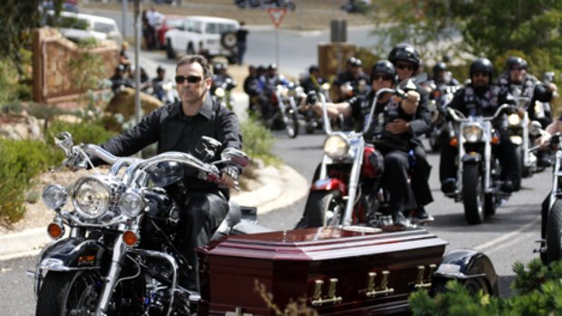 Final trip ... the coffin makes its way through the streets of Canberra yesterday accompanied by  about 300 members of the Rebels Motorcycle Club.