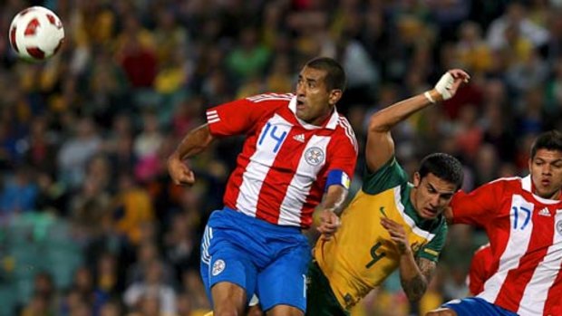 Tim Cahill in the thick of it against Paraguay on Saturday.