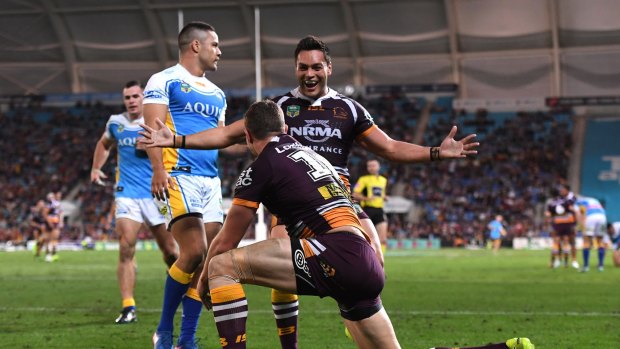 Rout: Alex Glenn rushed in to congratulate Corey Oates after another try.