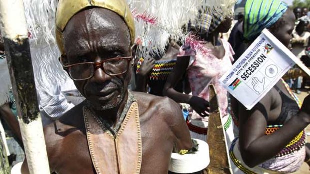 A traditionally dressed man dances during a rally on secession in Juba.