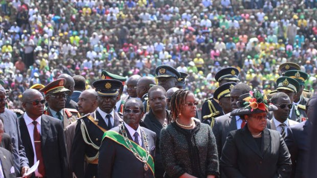 Zimbabwean President elect, Robert Mugabe, centre left, and his wife Grace, attend the country's commemoration of Heroes day, in Harare.