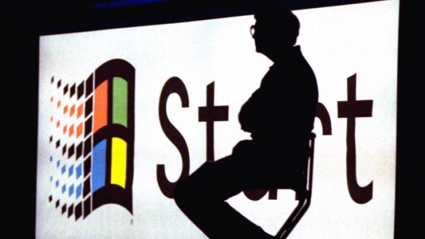Microsoft chairman Bill Gates sits on stage during a video portion of the Windows 95 Launch Event on the company's campus in Redmond, Washington in 1995.