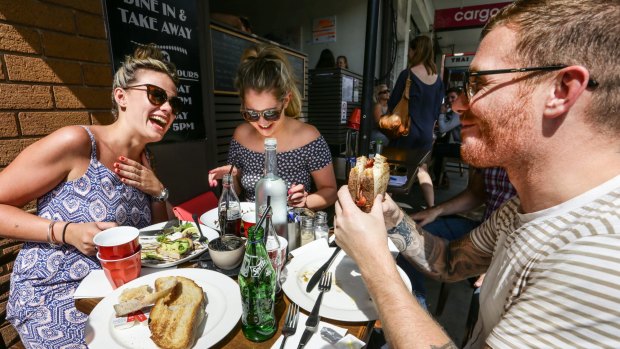 Hannah Campbell, Stephanie Hyde and 
David Wood enjoy a recovery breakfast at Coogee Cafe after a big night out. 