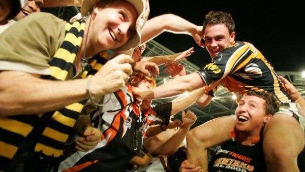 Night of the underdogs: Liam Fulton celebrates with great mate Bryce Gibbs after Wests Tigers won the 2005 premiership.