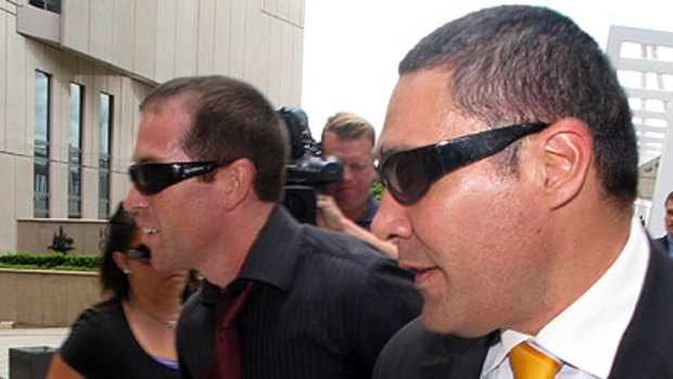 Alleged spammer Lance Atkinson (left) and his lawyer Darrell Kake (right) leave the Federal Court in Brisbane last week.