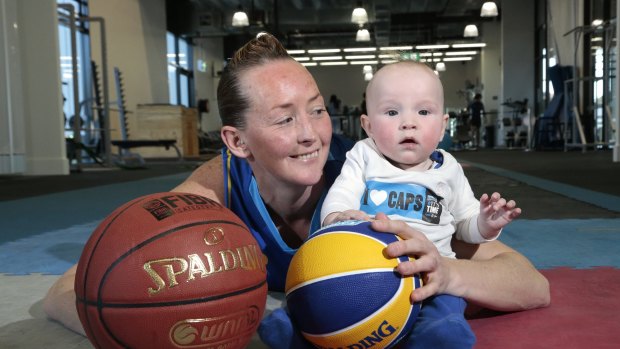The Canberra Capitals are hopeful Michelle Cosier (pictured with son Levi) will make her comeback this Saturday against Dandenong.