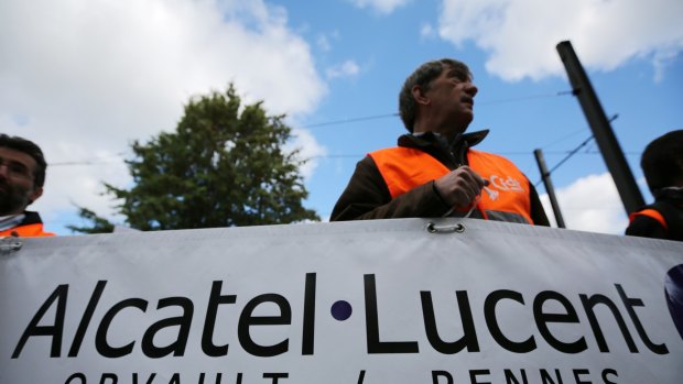 French workers protest against Alcatel-Lucent's cost-cutting plans.