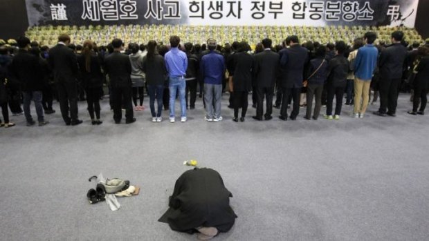 A Buddhist monk prays for victims at a group memorial altar in Ansan, south of Seoul.