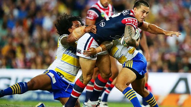 Sonny Bill Williams of the Roosters takes on the defence.