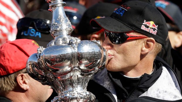 Sweet victory: James Spithill celebrates winning the America's Cup with Oracle.