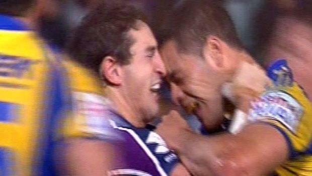 Full-contact sport ... Jarryd Hayne makes contact with Billy Slater.