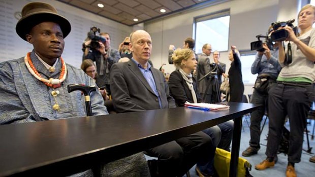 Blow to green groups ... Friends of the Earth campaign leader Geert Ritsema, second left, and plaintiff Eric Dooh.