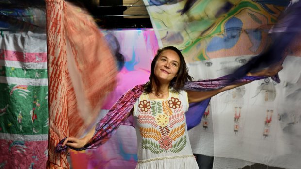 Young Australian artisan Emilie Cacace with a selection of fabrics digitally printed in her Sydney factory. 