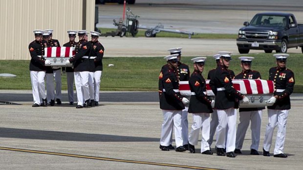 The bodies of the four Americans killed in Benghazi arrive home.
