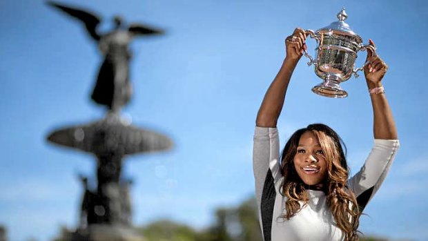 Serena Williams poses with her US Open trophy in Central Park.