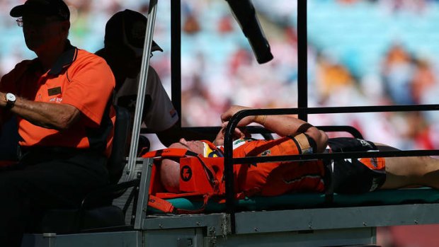 Casualty: Liam Fulton of the Tigers is taken from the field after being injured during against the Dragons.