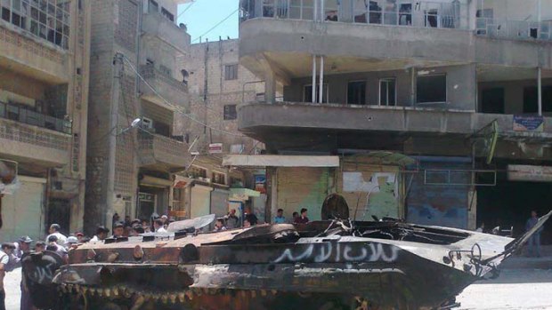 An army tank damaged by rebels in Idlib.