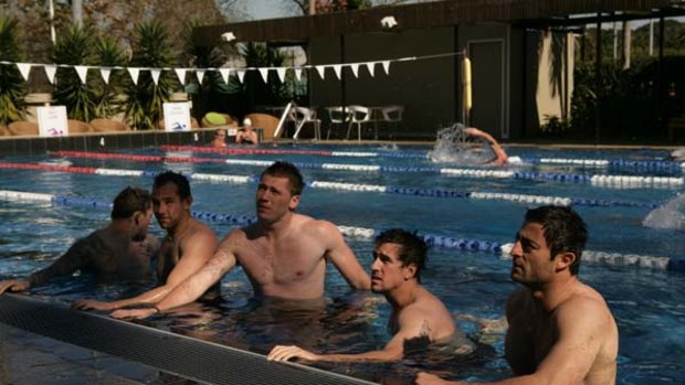 Water birds  ... the Roosters take to the Sydney Football Stadium pool yesterday after their hard-hitting clash against the Dragons on Sunday.