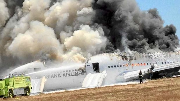 Asiana Airlines Boeing 777 is engulfed on the tarmac after crash landing at San Francisco.