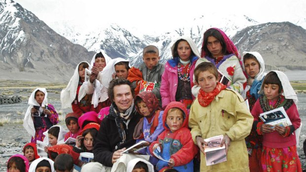Greg Mortenson poses with schoolchildren in Wakhan, Afghanistan.